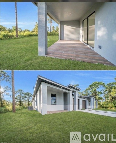 A modern house with a white exterior and a wooden deck.
