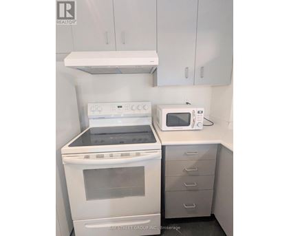 A white oven and microwave in a kitchen.