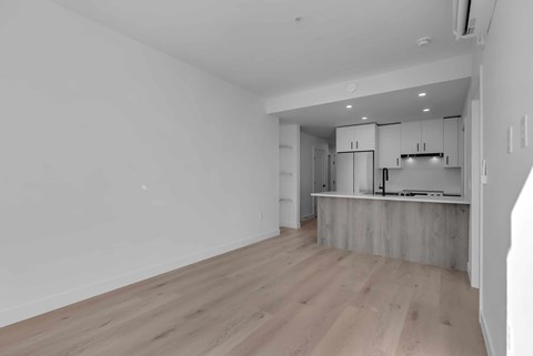 A kitchen area with a countertop and cabinets.