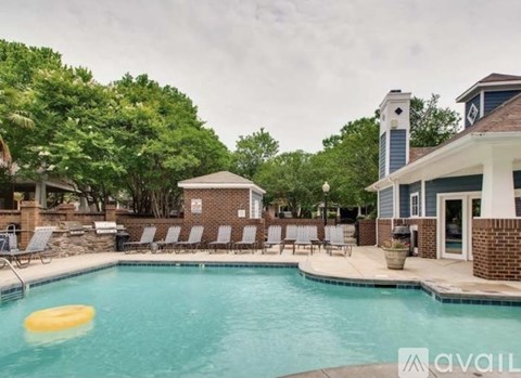 A pool with a yellow frisbee floating in it.