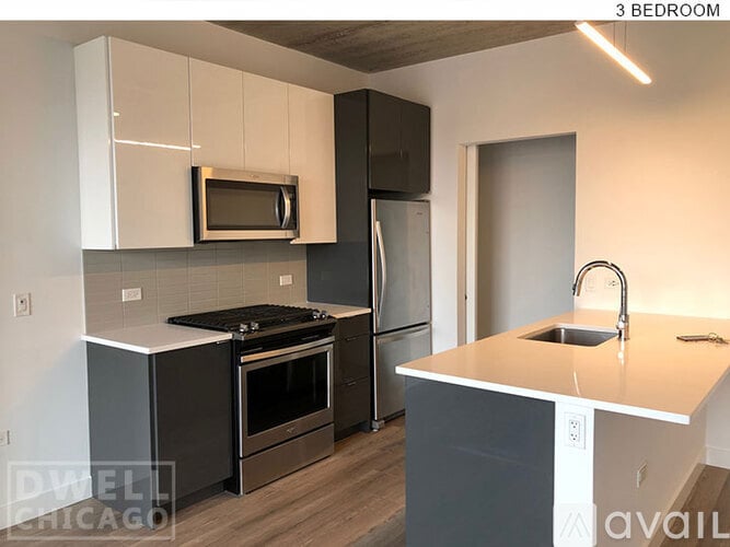A kitchen with a stove top oven and a microwave above it.