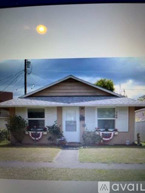 A house with a flag on the front porch.