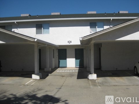 A parking garage with a car parked in the bottom right corner.
