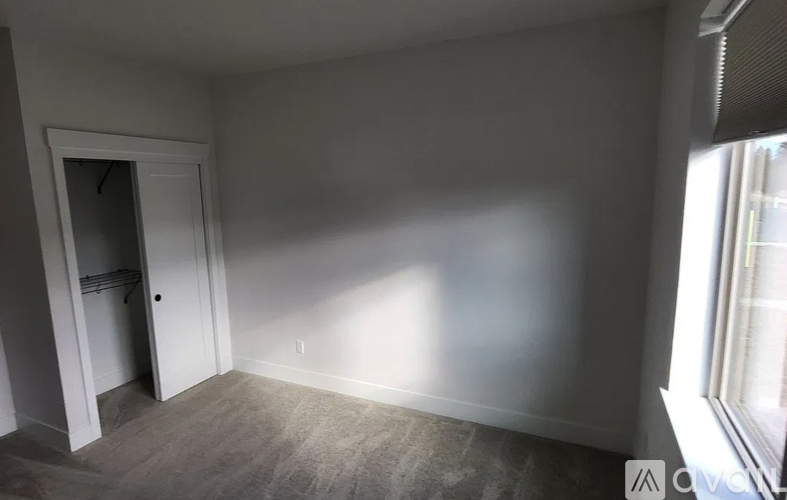 A room with a door and a window.