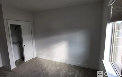 A room with a door and a window.
