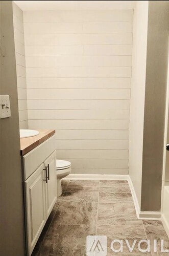 A bathroom with a toilet and a sink.