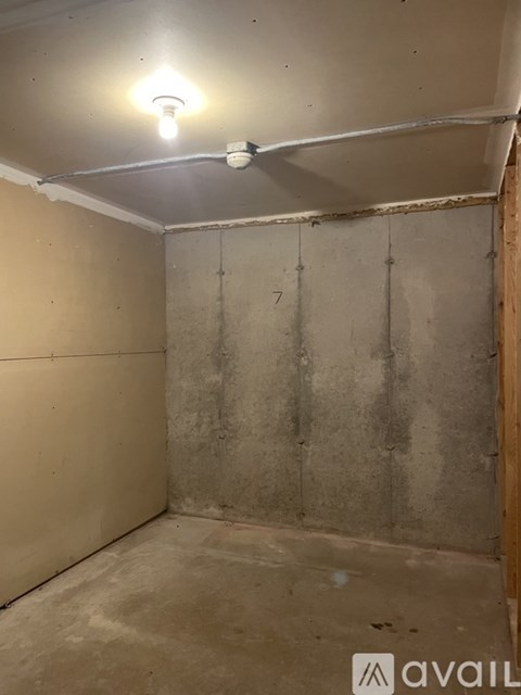 A room with a light on and a number 7 on the wall.