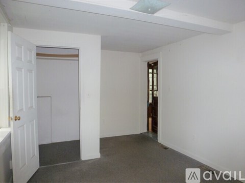 A room with a door and a window.
