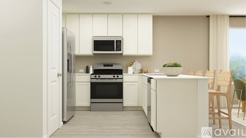 A kitchen with white cabinets and appliances, a wooden floor, and a window with white curtains.