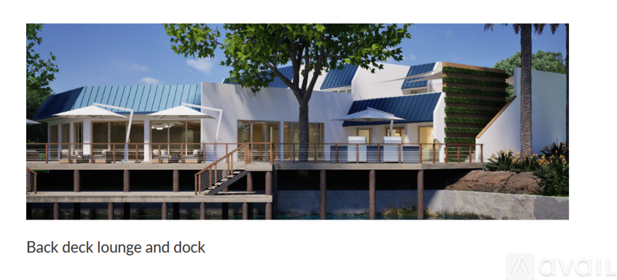 A modern building with a blue roof and a dock.