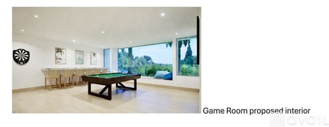 A pool table is in the middle of the room.