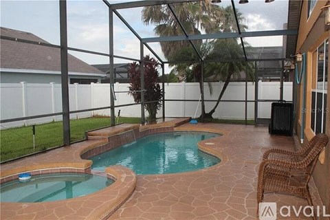 A pool with a hot tub in the middle of it.