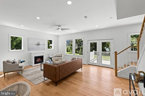 A living room with a fireplace and a couch.