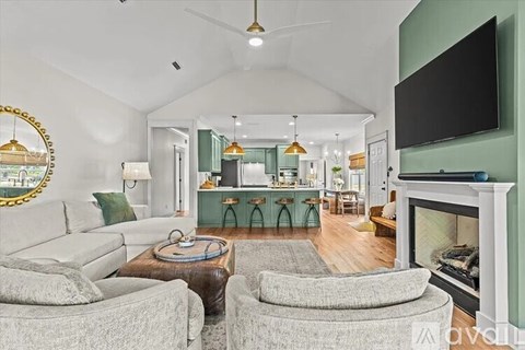 A living room with a grey couch and a coffee table.