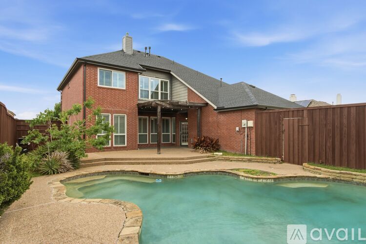 A house with a pool in the backyard.