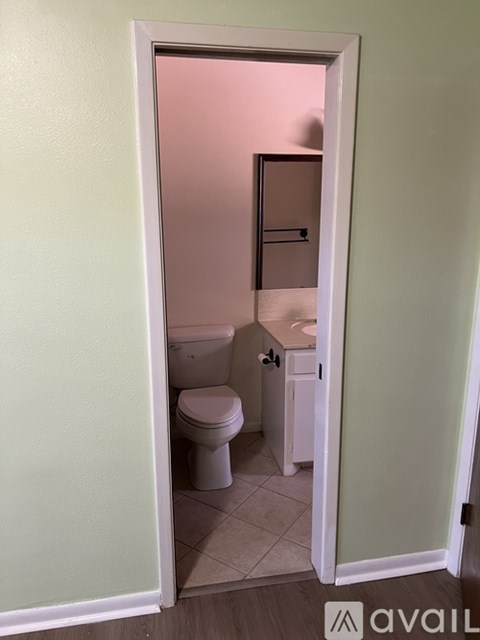 A bathroom with a toilet and sink.