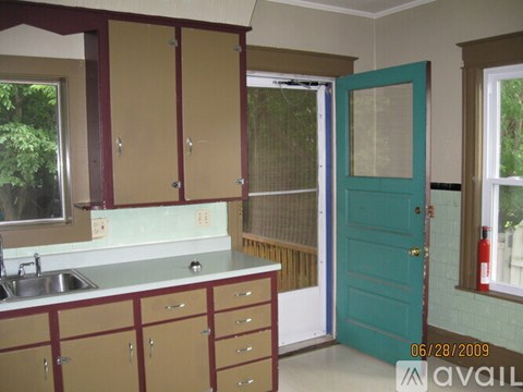 A kitchen with a sink and cabinets.