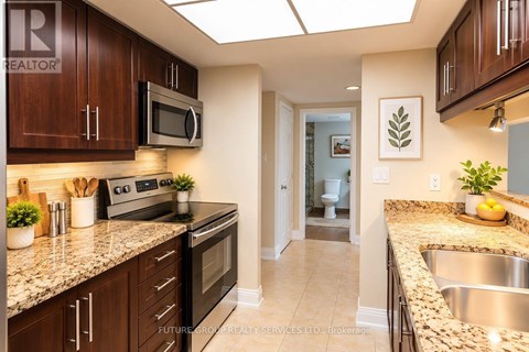 A kitchen with brown cabinets and a stove top oven.