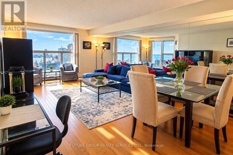 A well-lit living room with a dining table and chairs.