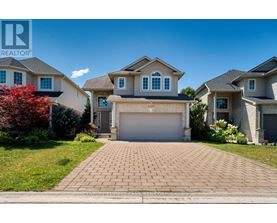A house with a driveway in front of it.