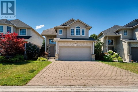 A house with a driveway in front of it.