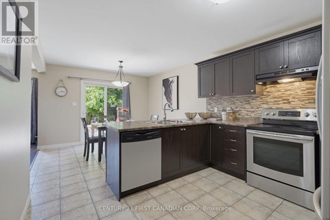 A kitchen with a stove top oven and a dishwasher.