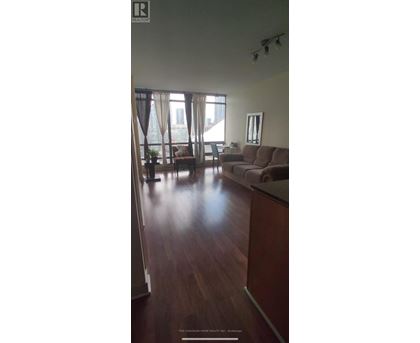 A living room with a couch and a chair.