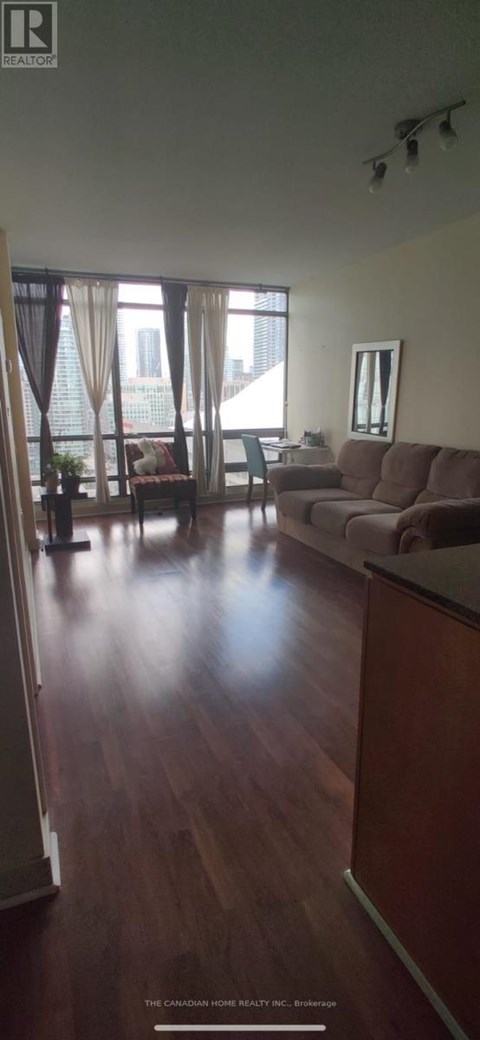 A living room with a couch and a chair.