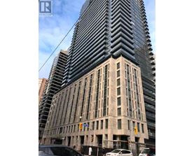 A tall building with a sign that reads AC REALTY BROUGHT IN.