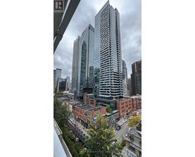 A cityscape with a mix of modern and older buildings.