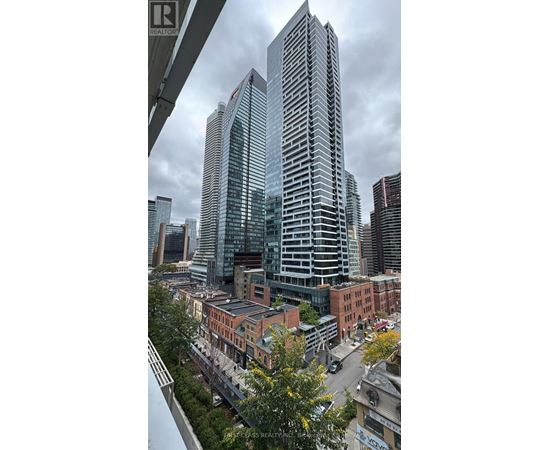 A cityscape with a mix of modern and older buildings.