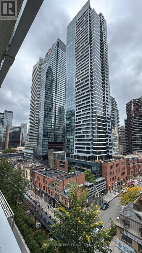 A cityscape with a mix of modern and older buildings.