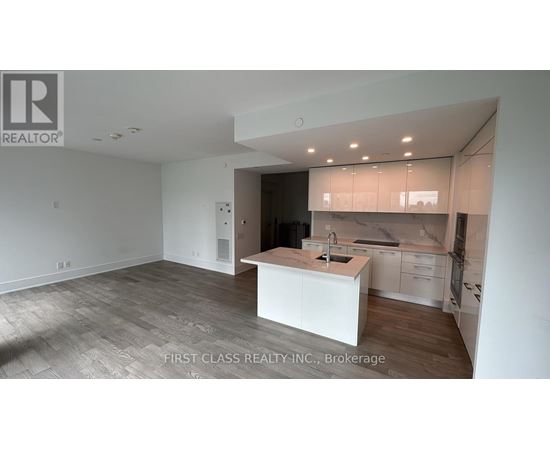 A kitchen area with a sink and cabinets.