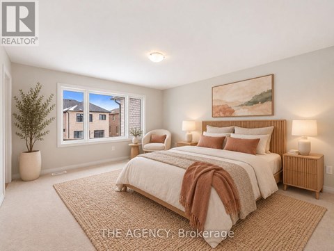 A bedroom with a large bed and a painting on the wall.