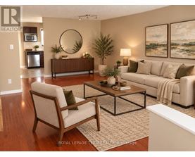 A living room with a couch, chair, and coffee table.