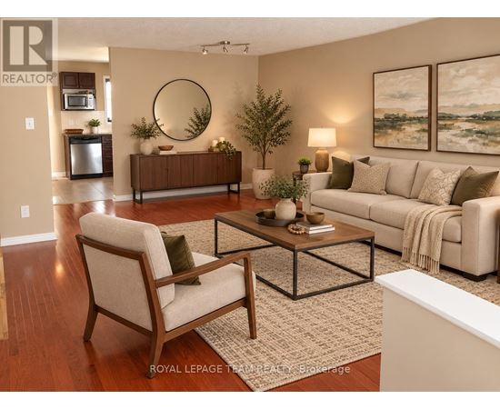 A living room with a couch, chair, and coffee table.
