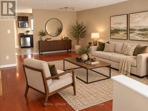A living room with a couch, chair, and coffee table.