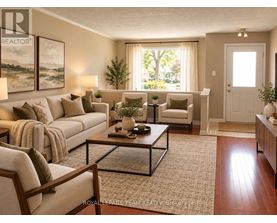 A well-lit living room with a large couch, a coffee table, and a view of the outdoors through the window.