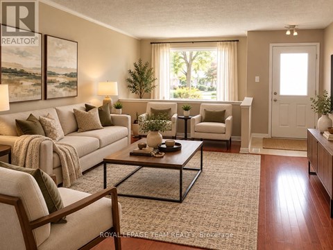A well-lit living room with a large couch, a coffee table, and a view of the outdoors through the window.