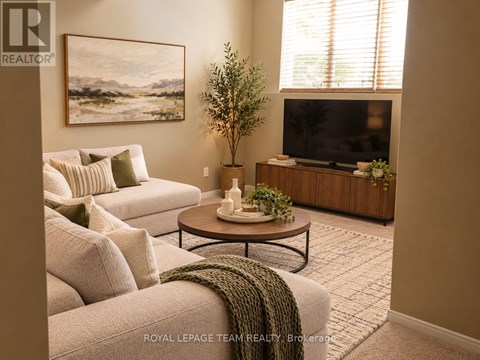 A living room with a couch, a coffee table, a television, and a plant.
