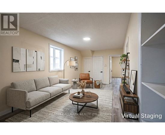 A living room with a grey couch and a coffee table.