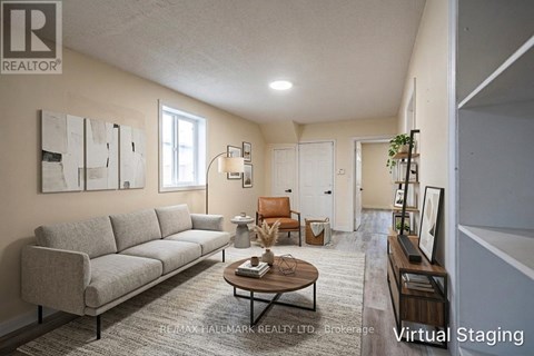 A living room with a grey couch and a coffee table.