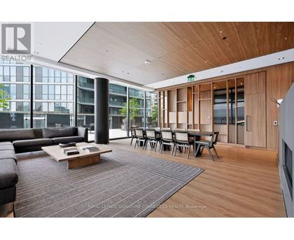 A living room with a couch, chairs, and a coffee table.