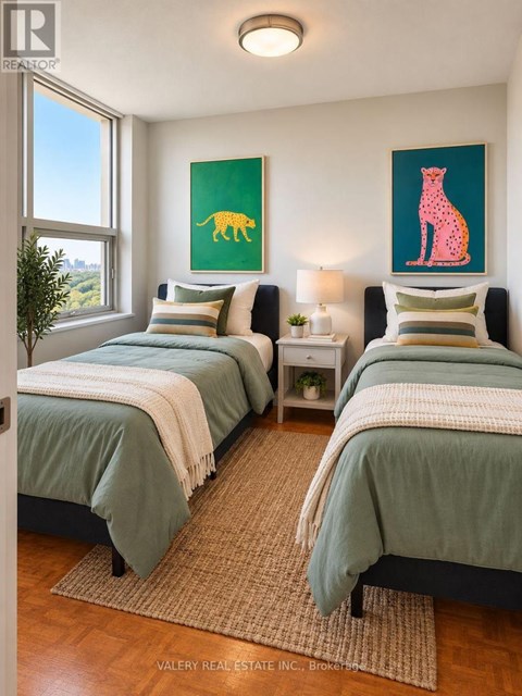 A bedroom with two beds and a painting of a giraffe on the wall.