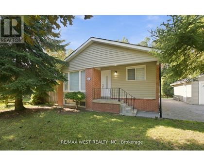 A house with a small front yard is for sale.