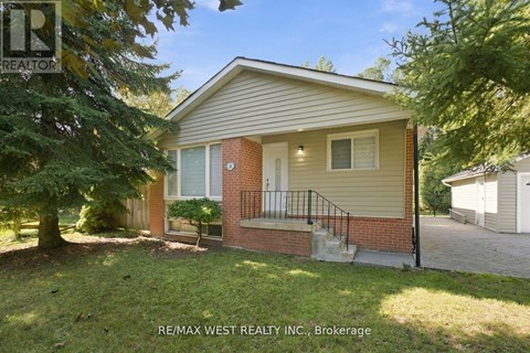 A house with a small front yard is for sale.