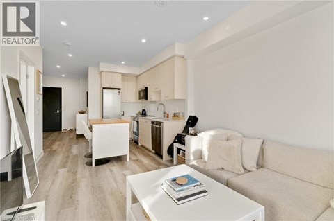 A modern living room with a white couch and a coffee table.