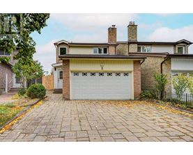 A house with a brick facade and a white garage door.