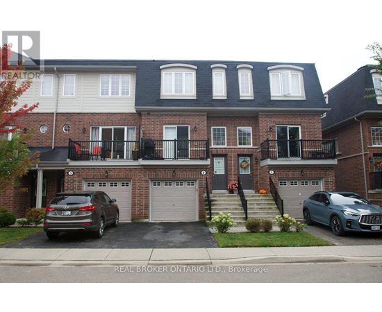 A house with a car parked in front of it.