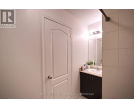 A bathroom with a sink and mirror.